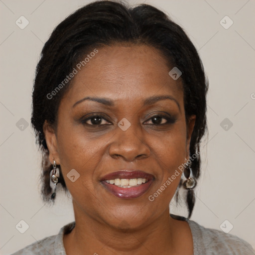 Joyful black adult female with medium  brown hair and brown eyes