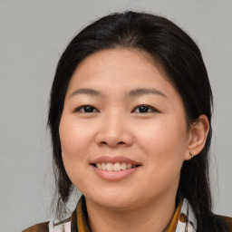 Joyful asian young-adult female with medium  brown hair and brown eyes