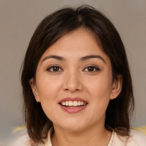 Joyful white young-adult female with medium  brown hair and brown eyes