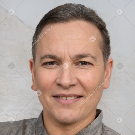 Joyful white adult male with short  brown hair and brown eyes