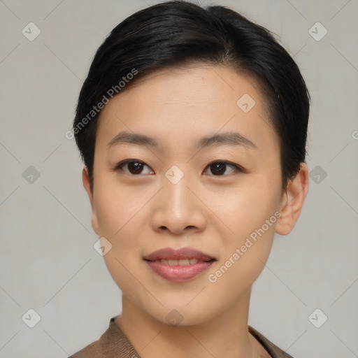 Joyful asian young-adult female with short  black hair and brown eyes