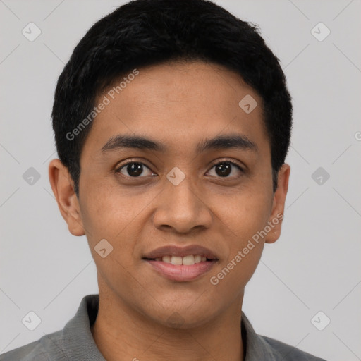 Joyful latino young-adult male with short  black hair and brown eyes