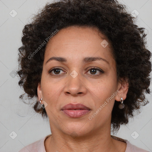 Joyful black adult female with medium  brown hair and brown eyes