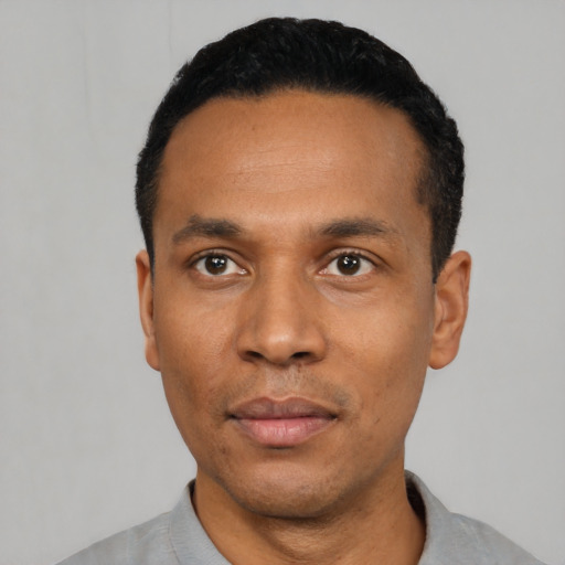 Neutral latino young-adult male with short  black hair and brown eyes