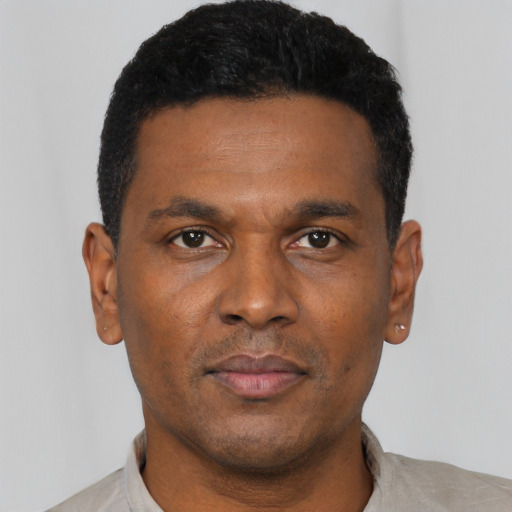 Neutral black young-adult male with short  black hair and brown eyes