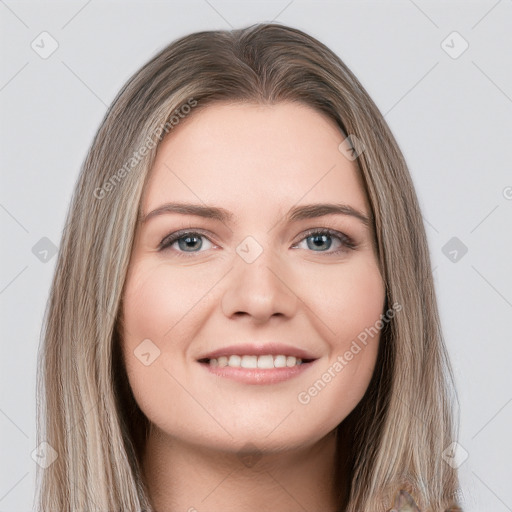 Joyful white young-adult female with long  brown hair and grey eyes