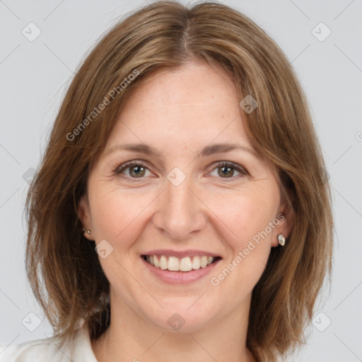 Joyful white adult female with medium  brown hair and brown eyes