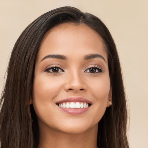 Joyful white young-adult female with long  brown hair and brown eyes