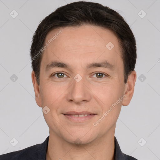 Joyful white adult male with short  brown hair and brown eyes