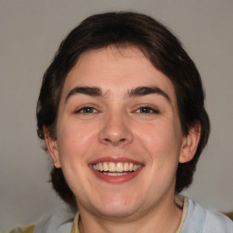 Joyful white young-adult male with medium  brown hair and brown eyes