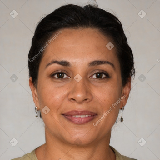 Joyful latino adult female with short  brown hair and brown eyes