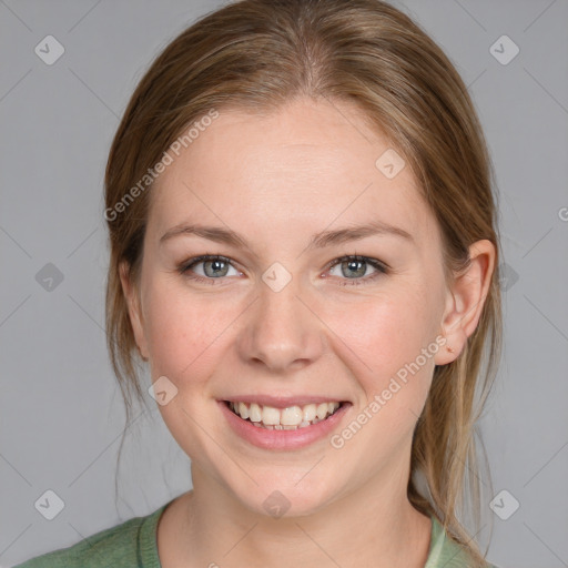 Joyful white young-adult female with medium  brown hair and blue eyes