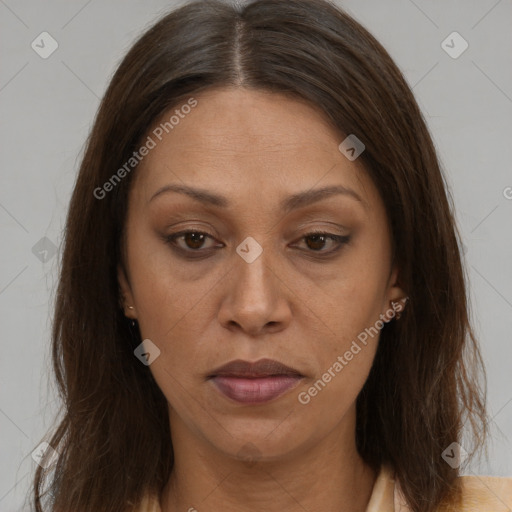 Joyful white adult female with long  brown hair and brown eyes