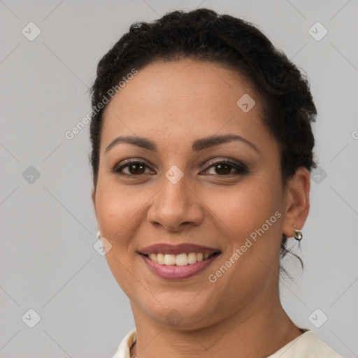 Joyful latino young-adult female with short  brown hair and brown eyes