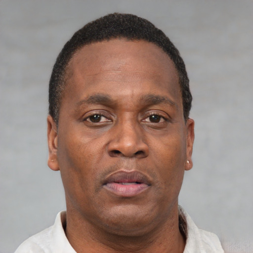 Neutral black adult male with short  black hair and brown eyes