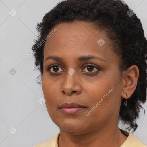 Neutral black young-adult female with short  brown hair and brown eyes