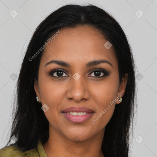 Joyful black young-adult female with long  brown hair and brown eyes