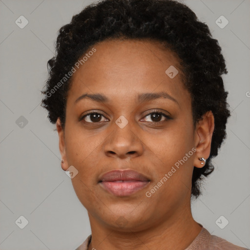 Joyful black young-adult female with short  black hair and brown eyes