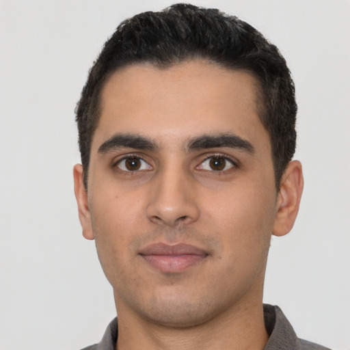 Neutral latino young-adult male with short  black hair and brown eyes