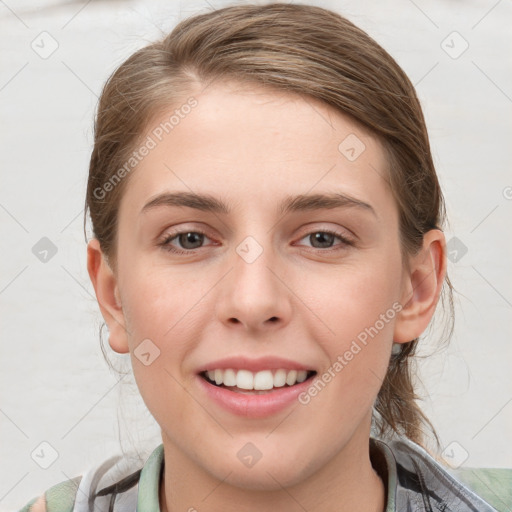 Joyful white young-adult female with medium  brown hair and grey eyes