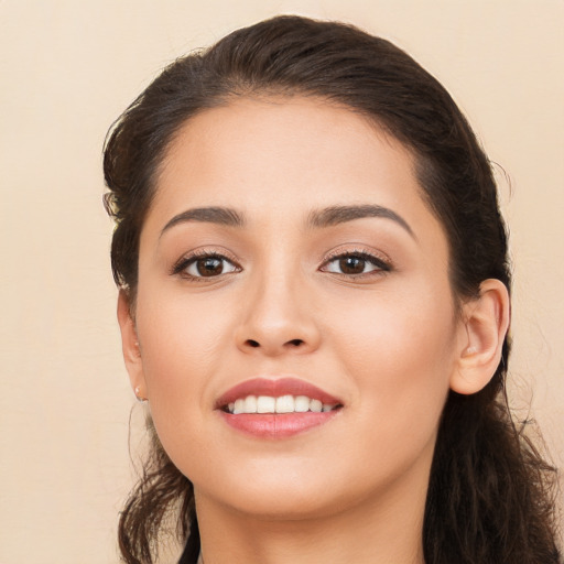 Joyful white young-adult female with long  brown hair and brown eyes