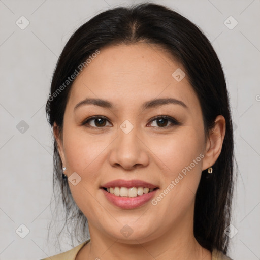 Joyful latino young-adult female with medium  brown hair and brown eyes