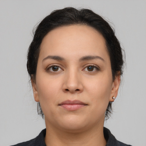 Neutral latino young-adult female with medium  brown hair and brown eyes