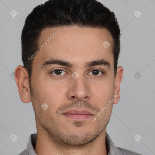 Joyful white young-adult male with short  brown hair and brown eyes