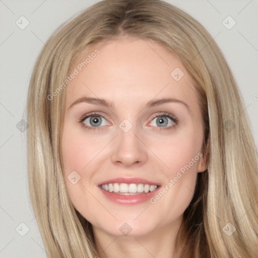 Joyful white young-adult female with long  brown hair and blue eyes