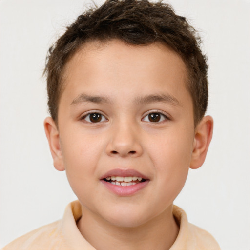 Joyful white child male with short  brown hair and brown eyes