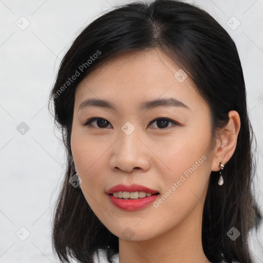 Joyful asian young-adult female with medium  brown hair and brown eyes