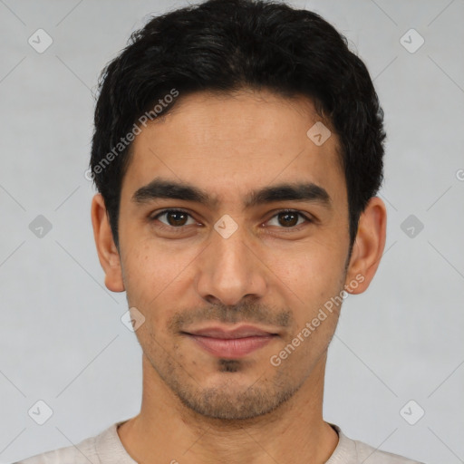 Joyful latino young-adult male with short  black hair and brown eyes