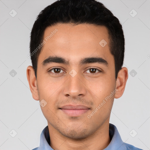 Joyful white young-adult male with short  black hair and brown eyes