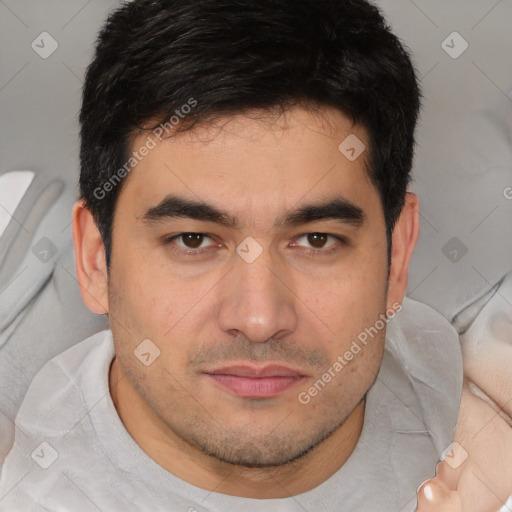 Joyful white young-adult male with short  black hair and brown eyes