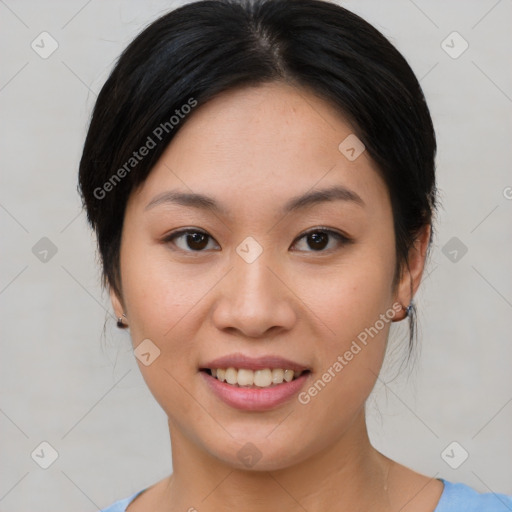 Joyful asian young-adult female with medium  black hair and brown eyes