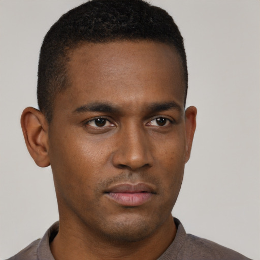 Neutral black young-adult male with short  black hair and brown eyes