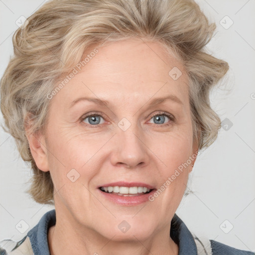 Joyful white adult female with medium  brown hair and blue eyes