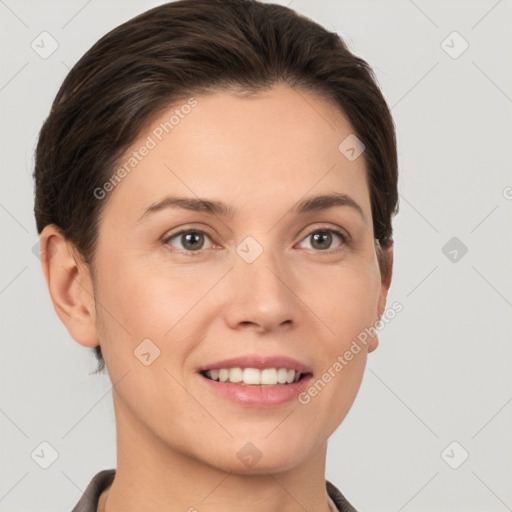 Joyful white young-adult female with short  brown hair and grey eyes