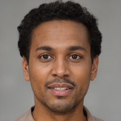 Neutral latino young-adult male with short  brown hair and brown eyes