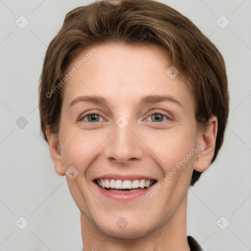 Joyful white young-adult female with short  brown hair and grey eyes