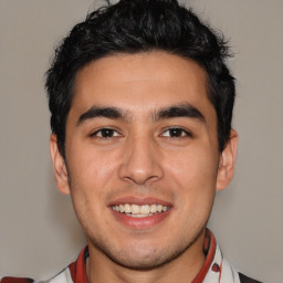Joyful white young-adult male with short  black hair and brown eyes
