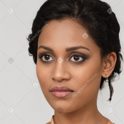 Joyful latino young-adult female with medium  brown hair and brown eyes