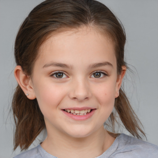 Joyful white child female with medium  brown hair and brown eyes