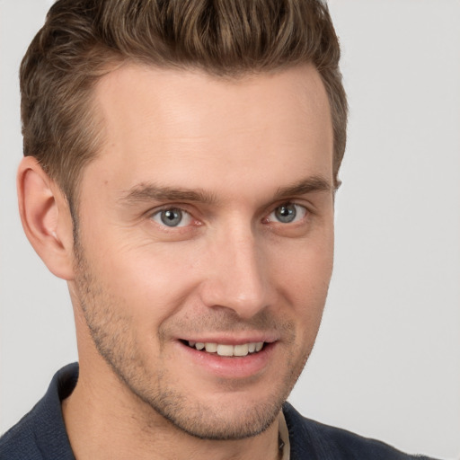 Joyful white young-adult male with short  brown hair and brown eyes