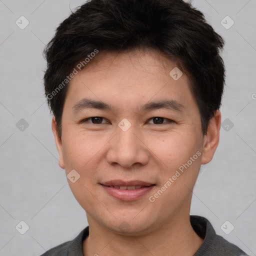 Joyful asian young-adult male with short  brown hair and brown eyes