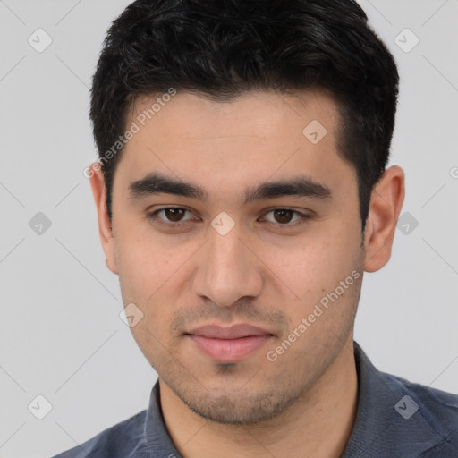 Joyful white young-adult male with short  black hair and brown eyes