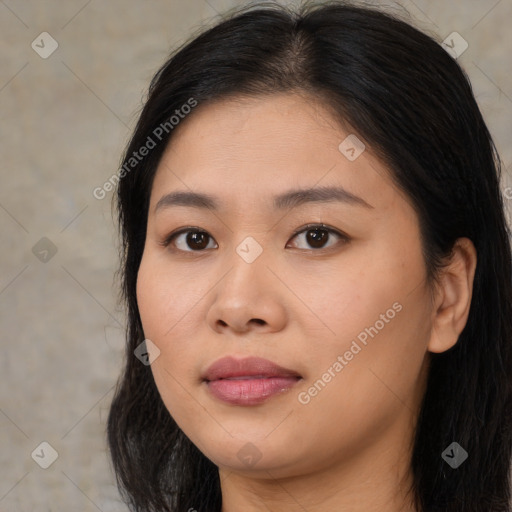 Joyful asian young-adult female with long  brown hair and brown eyes