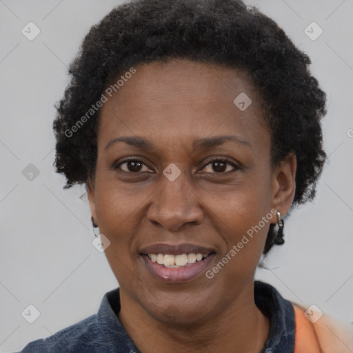 Joyful black adult female with short  brown hair and brown eyes