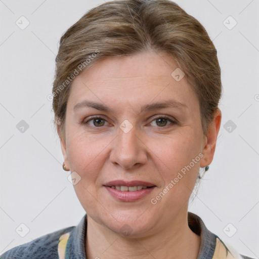 Joyful white adult female with short  brown hair and grey eyes