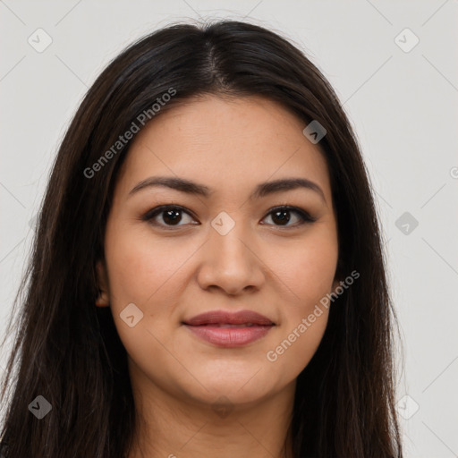 Joyful latino young-adult female with long  brown hair and brown eyes